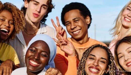 The photo shows a group of multi-ethnic and gender diverse young adults.